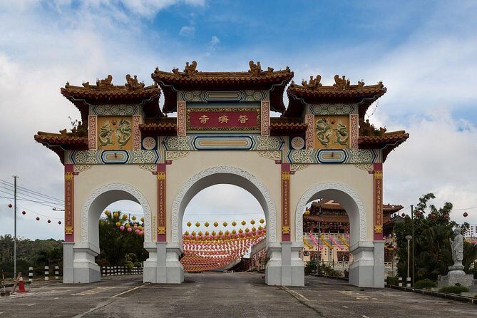 Day Trip Sepilok Orang-utan And City Tour - Sandakan city time: Central Market, Sim-Sim Water Village, and a temple stop