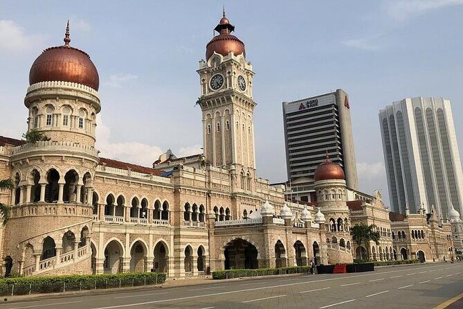 Kuala Lumpur City & Batu Caves Temple Private Tour - Batu Caves: the limestone landmark and that golden front view