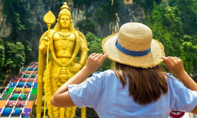 Kuala Lumpur Day Tour: Batu Caves & Elephant Sanctuary - Batu Caves: the 42.7m Golden Murugan moment