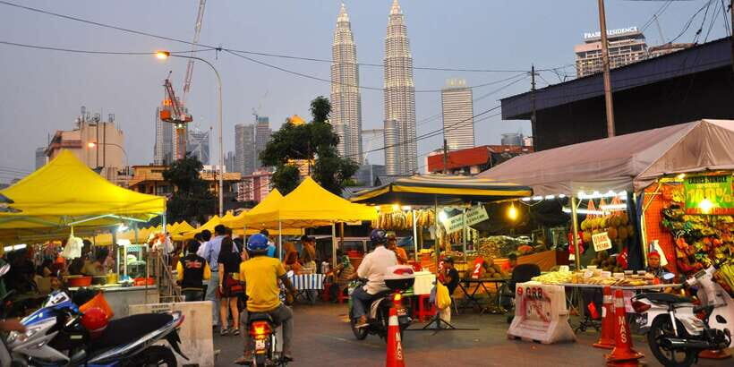 Kuala Lumpur: Half Day Local Food Walking Tour - The short train hop that saves your legs