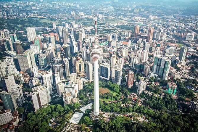 Kuala Lumpur Tower Admission Ticket with Private Hotel Pickup - Beyond the views: Upside-Down House, XD Theatre, and F1 Simulator