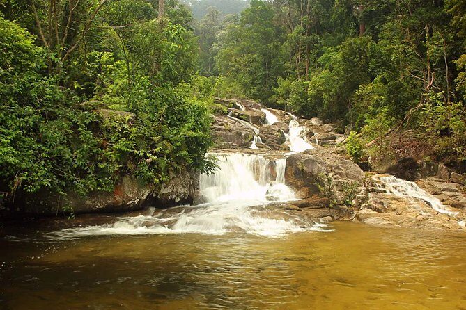 Private Kanching Waterfalls with Batu Caves & Ramayana Caves Tour - Kanching Falls in the Rawang rainforest: seven tiers, cooling spray, and optional dips