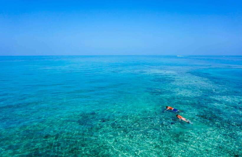 Semporna: Explore 3 Islands Tour Snorkel or Dive & Lunch - Pandanan bay and island: snorkeling plus the conservation entry reality