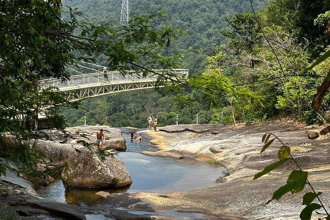 Telaga Tujuh Waterfall Half Day and Sacred Blue Pool Tour - Telaga Tujuh Bottom Stop: The Waterfall Views and Local Drinks
